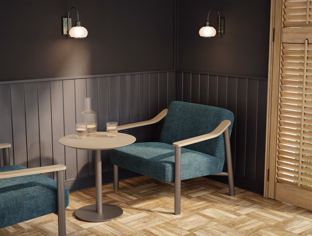 3D furniture visualization of a teal upholstered lounge chair with oak arms beside a round table in a dark-paneled bistro with herringbone floor