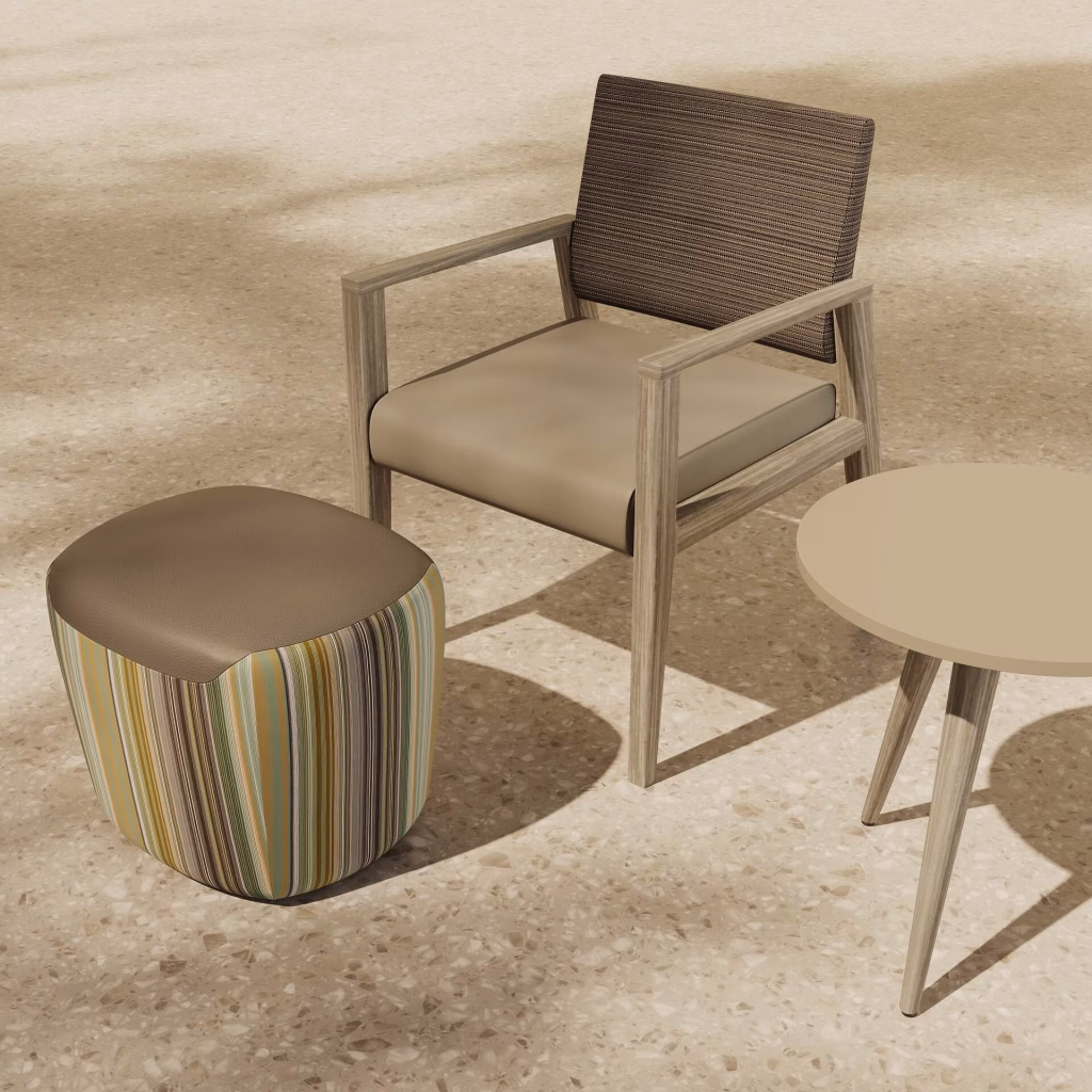 3D furniture visualization vignette of a textured armchair with a striped pouf in dark leather cap and a round side table on terrazzo