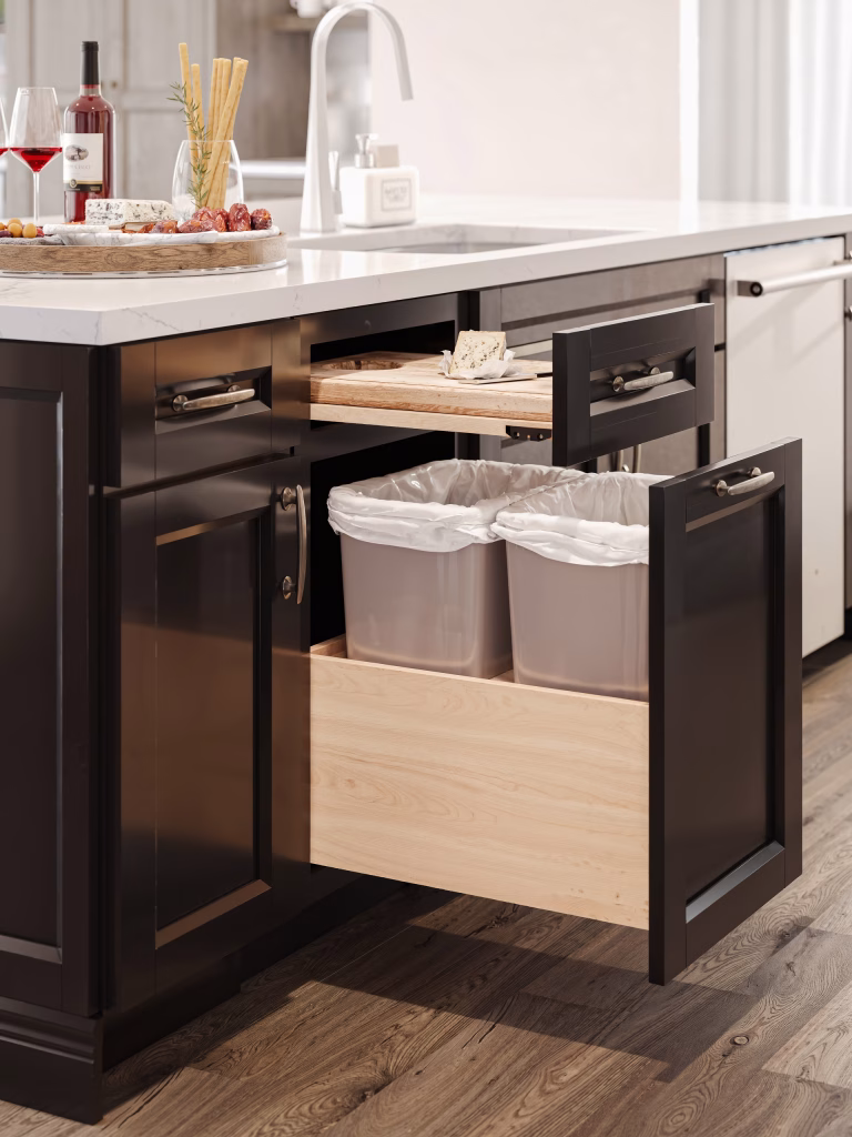 3D visualization of a dark cabinet island with open pull-out waste bin and sliding cutting board