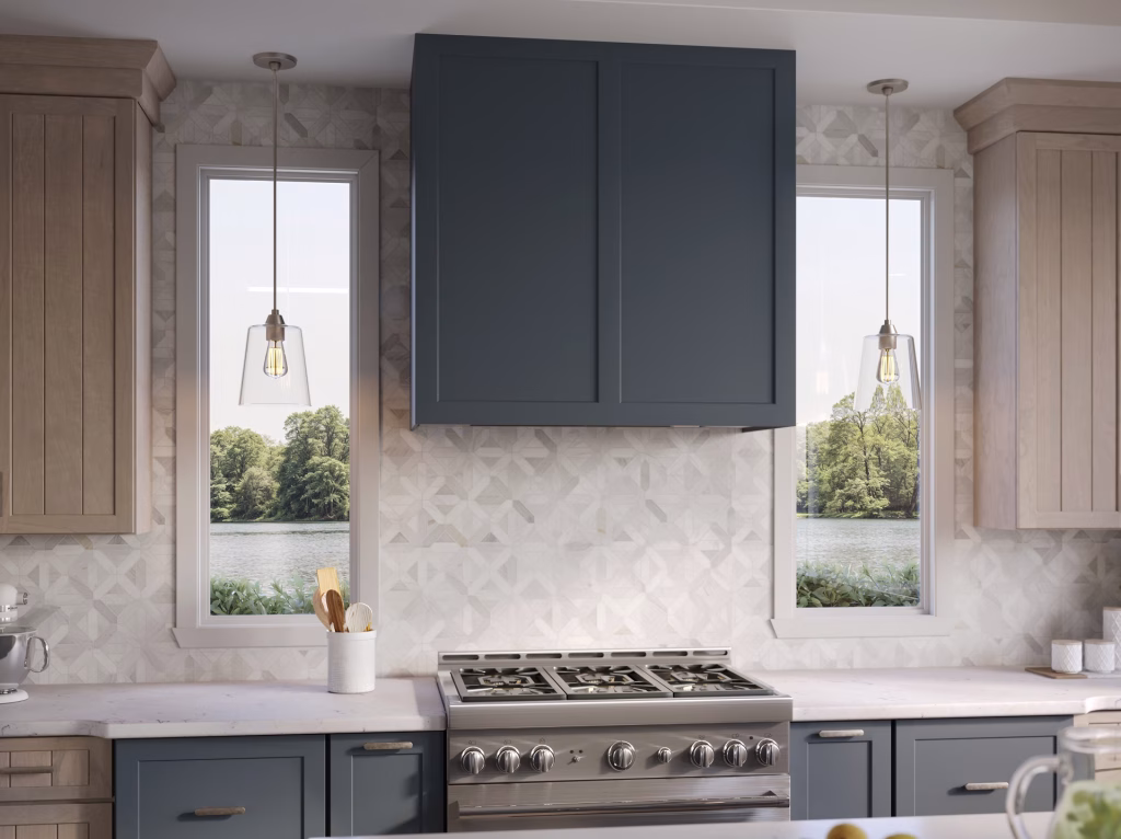 3D visualization close-up of a slate blue range hood and geometric tile backsplash in a coastal kitchen