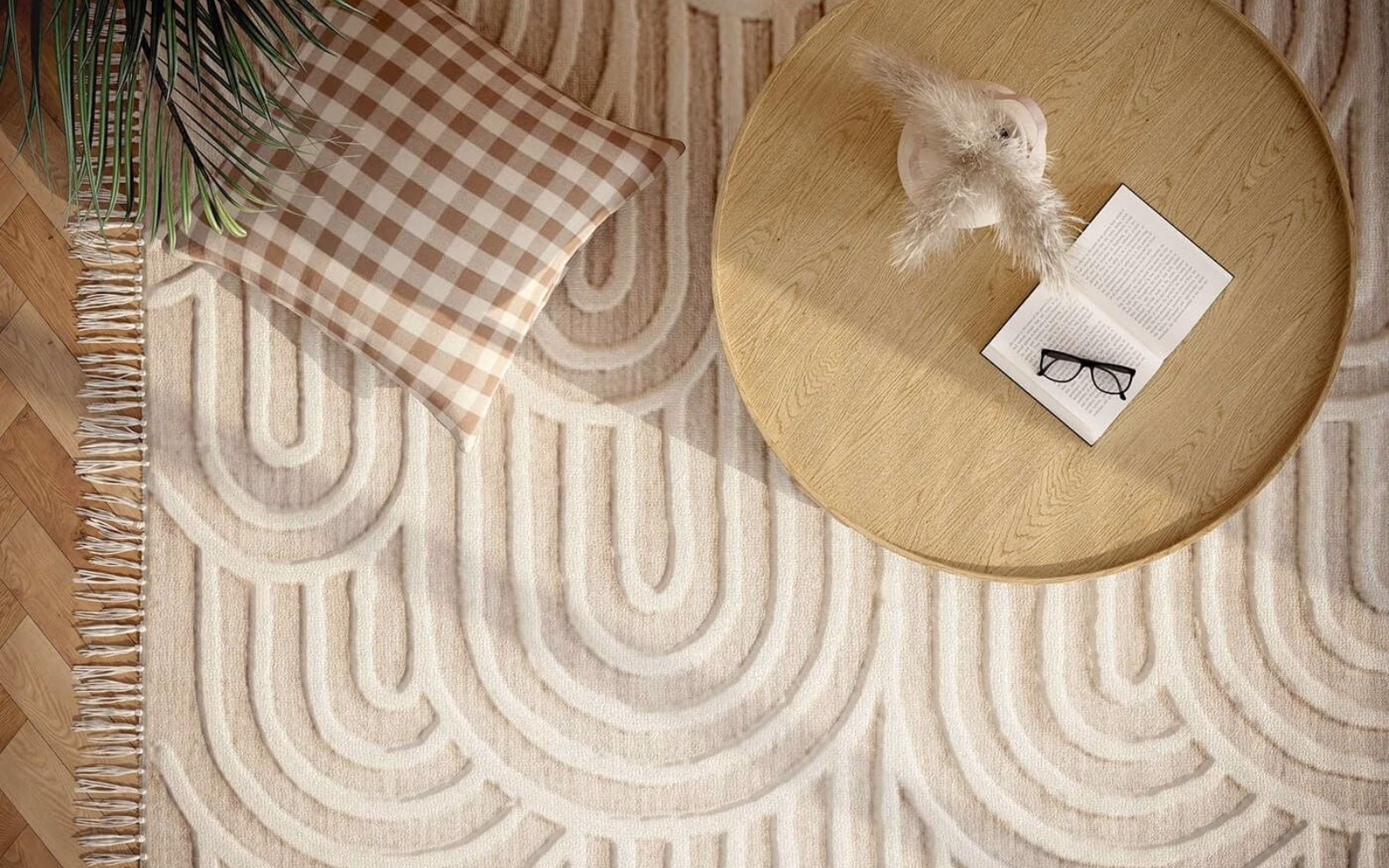 Overhead render of a patterned area rug on a wood floor