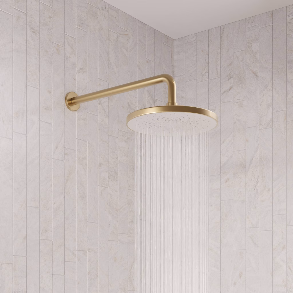 Close-up 3D render of a brushed gold rain shower on a wall arm with water running