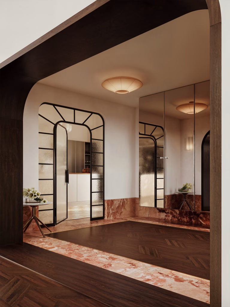3D visualization of an Art Deco entry hall seen through a dark wood portal, with a reeded glass door in a black steel frame, mirrored cabinet doors and a red marble floor border