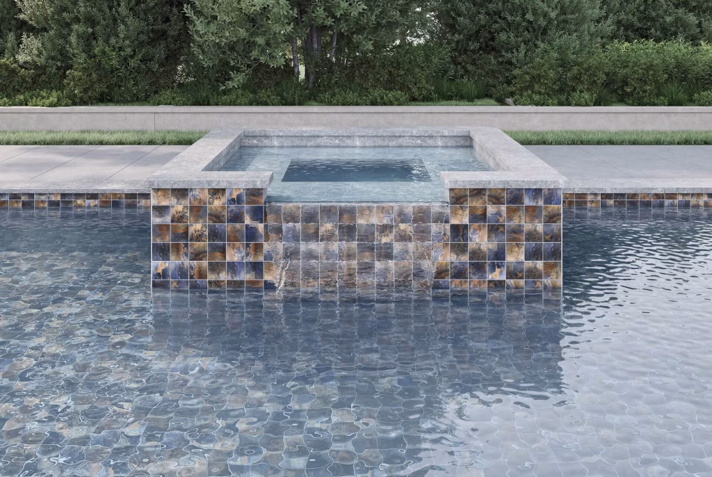CGI render of a raised spa with a sheet waterfall spilling into a pool, clad in blue and copper stone-look tile
