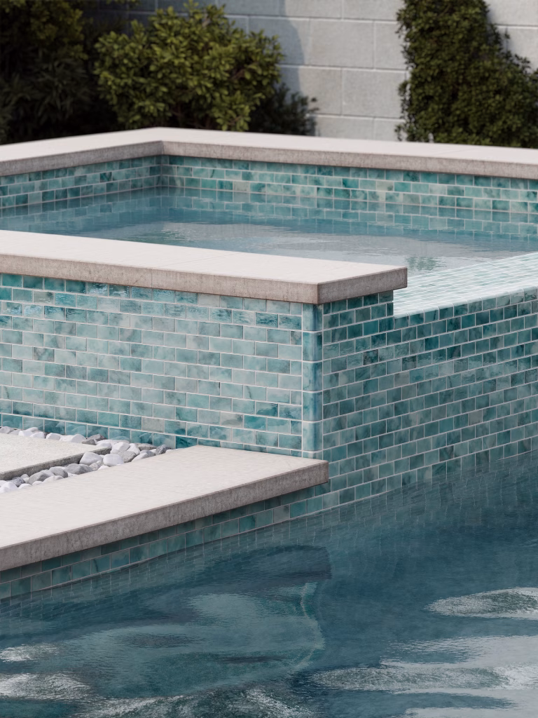 Rendering of a raised spa clad in turquoise marbled glass mosaic laid in a brick pattern, with light stone coping