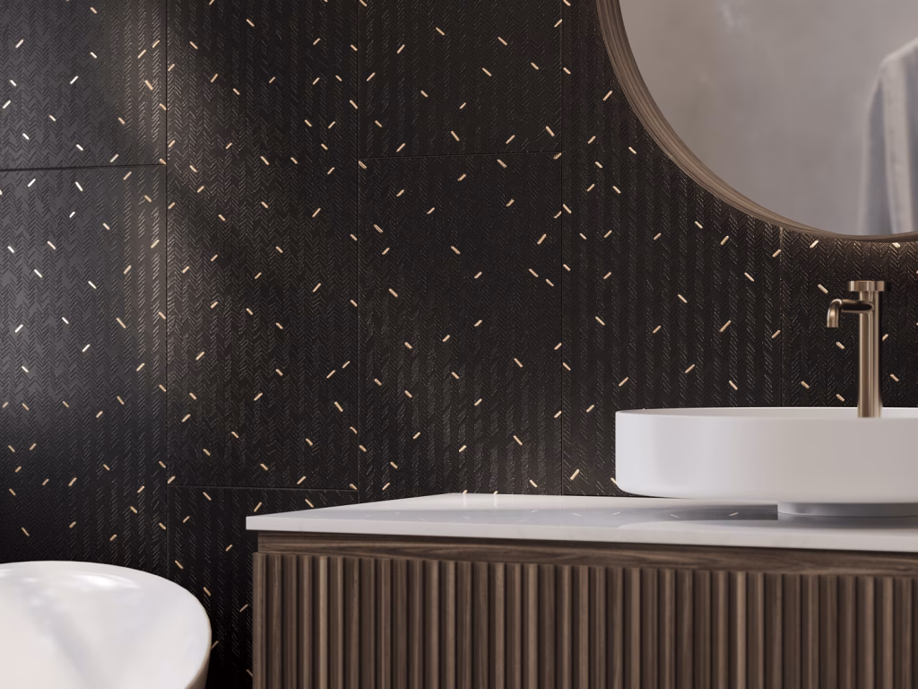 Close-up render of black herringbone-textured tile with gold inlay details above a white vessel sink