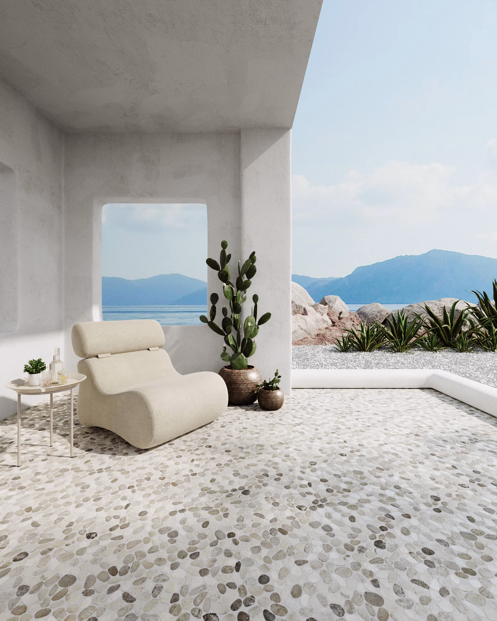 3D render of a covered seaside terrace floored in cream and grey flat pebble tile, with a lounge chair, potted cactus and a sea view