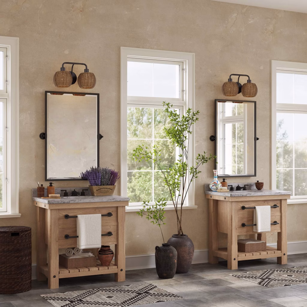 3D rendering of two-light rattan globe vanity sconces for Livex Lighting above twin wooden bathroom vanities
